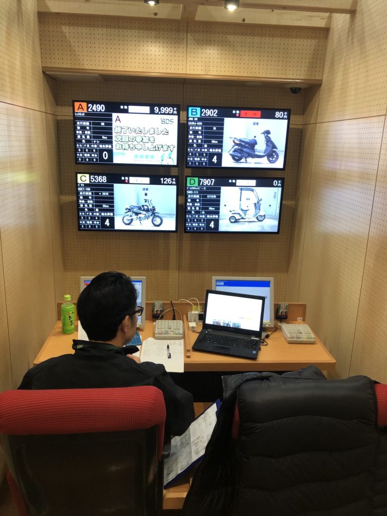 Hiroshi-san choosing bikes