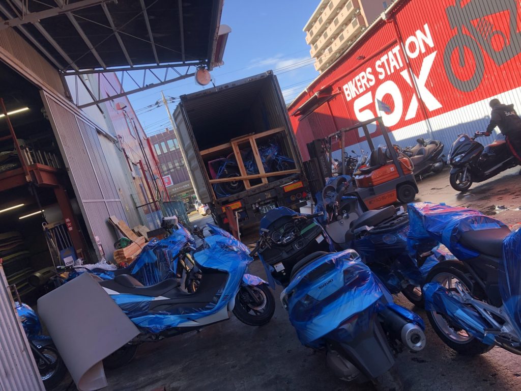 Motorbikes waiting to load